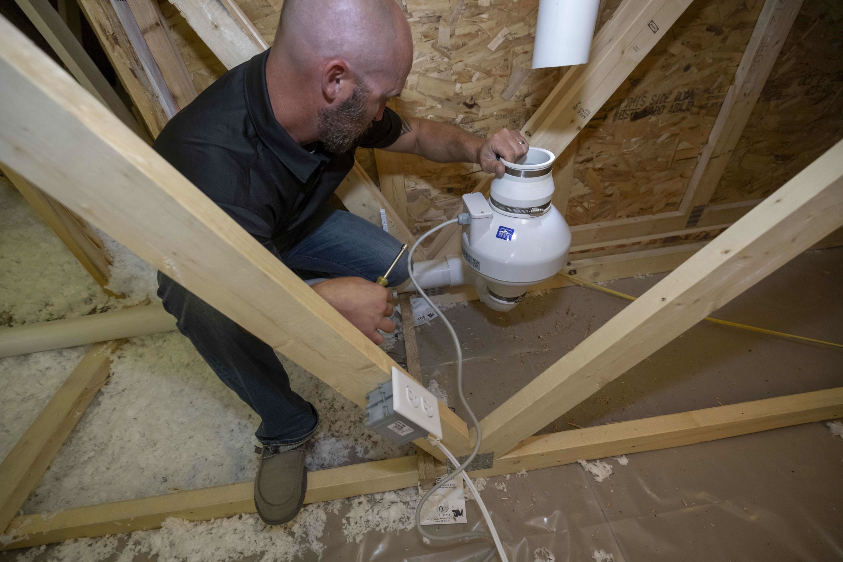 Radon System Repair and Fan Replacement Technician in Attic