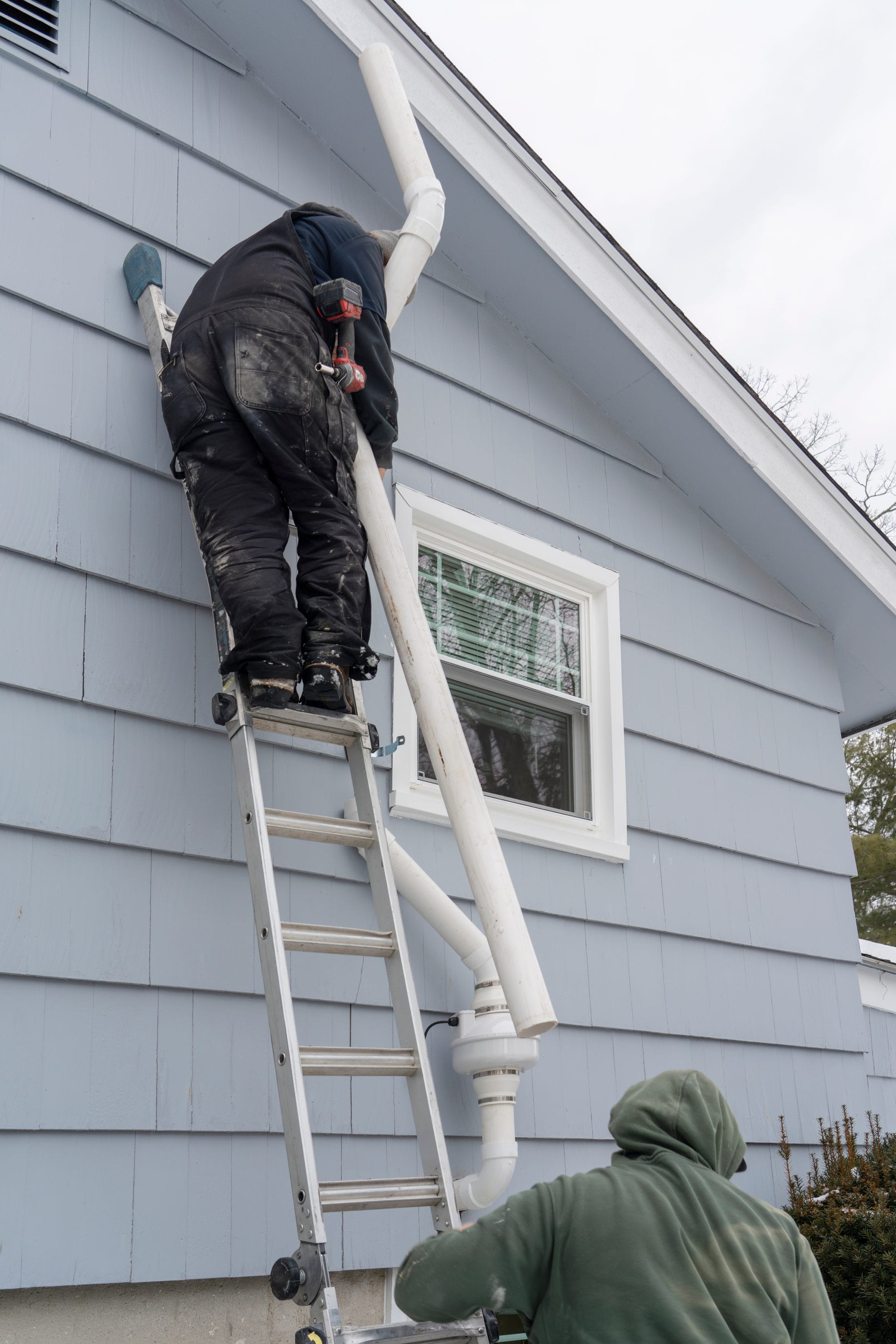 Stock image of a radon system repair in progress.
